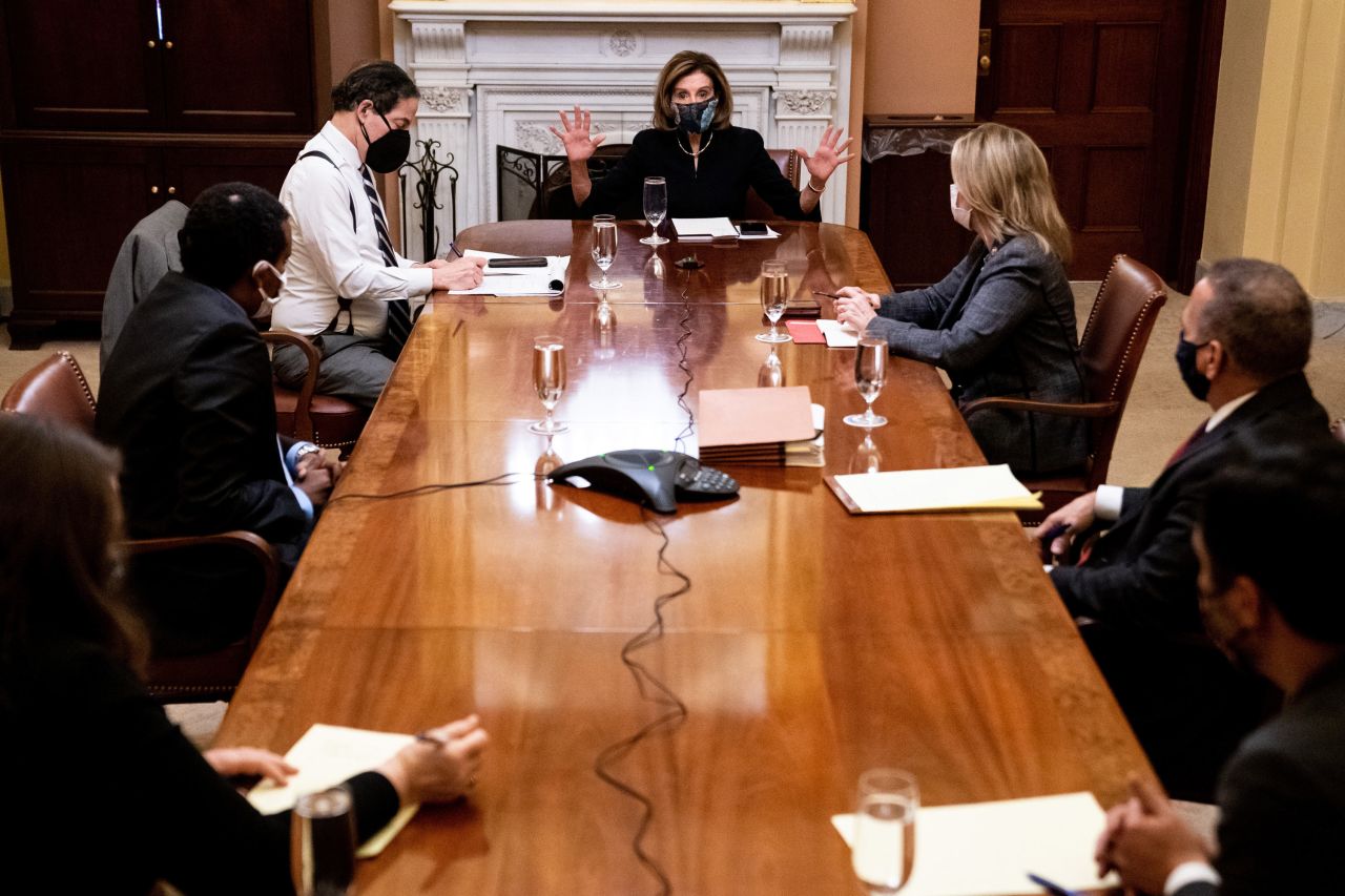 House Speaker Nancy Pelosi meets with the House impeachment managers inside the Capitol ahead of the final vote on Wednesday, January 13.