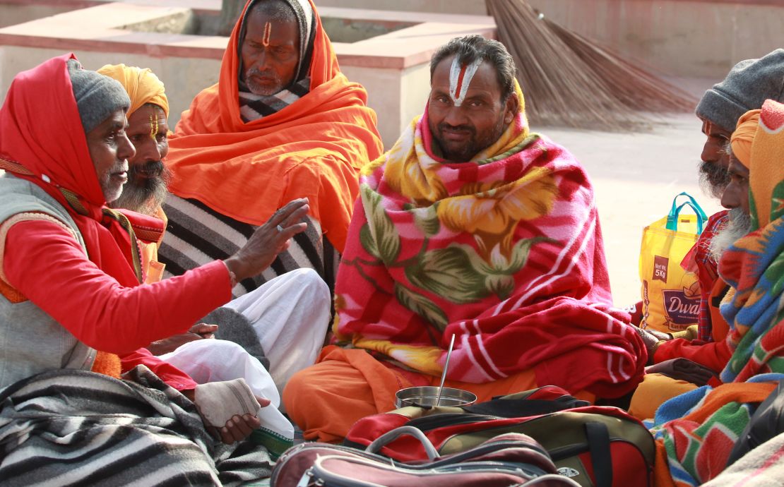 Indian Hindu devotees sit on the banks of the River Ganges in Haridwar on January 14.