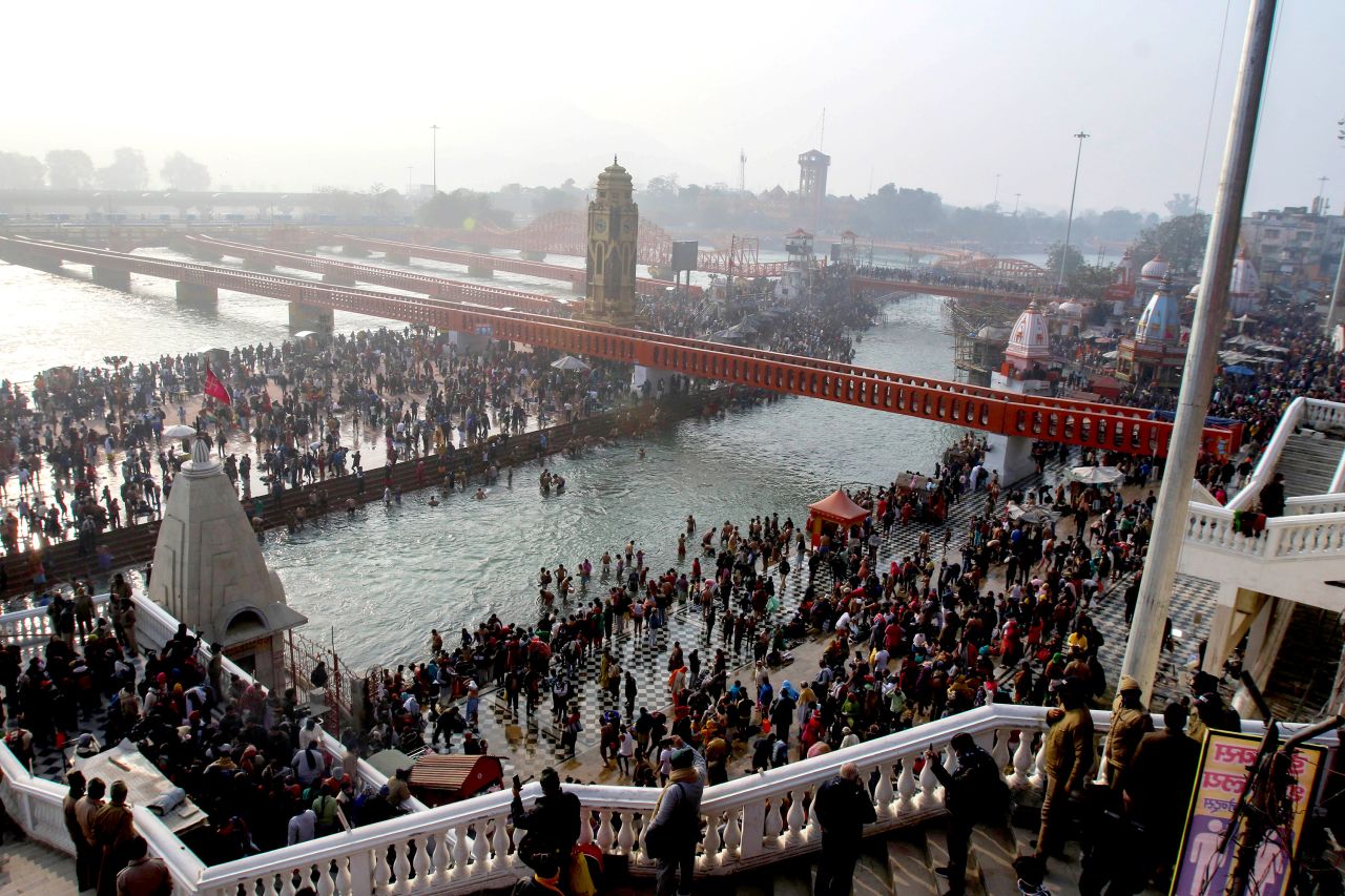 Indian Hindu devotees gather at the River Ganges during Makar Sankranti, a day considered to be of great religious significance in Hindu mythology, on January 14, 2021.