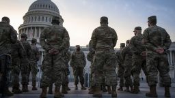 Members of the National Guard assemble outside of the U.S. Capitol in Washington, D.C., U.S., on Thursday, Jan. 14, 2021. President Trump's unprecedented second impeachment heads to the Senate, where his fate rests with Republican leader McConnell, who now has more leverage than ever over the president in his final week in office. 