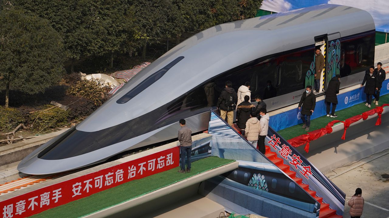 People visit a prototype magnetic levitation train developed with high-temperature superconducting (HTS) maglev technology at the launch ceremony in Chengdu, in southwestern China's Sichuan province on January 13, 2021. (Photo by STR / AFP) / China OUT (Photo by STR/AFP via Getty Images)