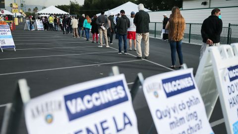 People wait to receive the Covid-19 vaccine in a parking lot at Disneyland Resort on January 13.