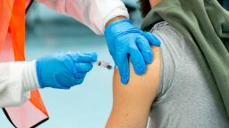 A man receives a dose of the Moderna coronavirus disease (COVID-19) vaccine at a vaccination site at South Bronx Educational Campus, in the Bronx New York on January 10, 2021. 
