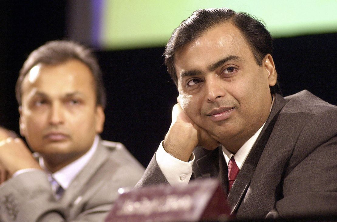 India's largest private sector company Reliance Industries Chairman and Managing Director Mukesh Ambani (R) along with then Vice Chairman Anil Ambani listen to shareholders opinions at the company's Annual General Meeting in Mumbai on June 24, 2004. 