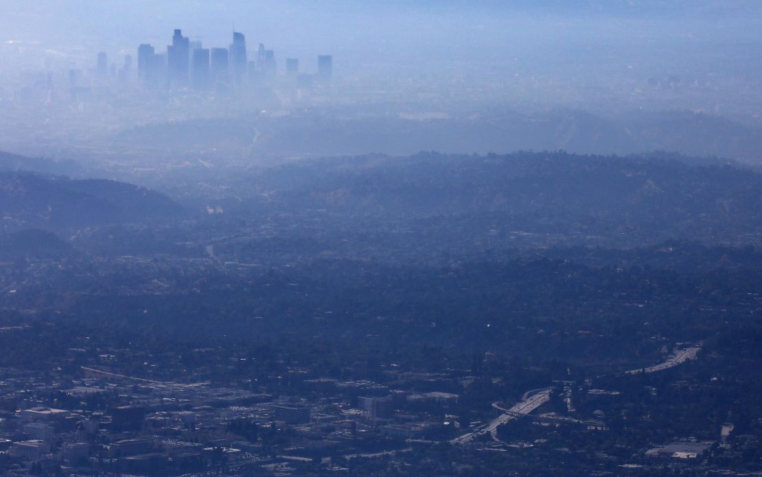 The buildings of downtown Los Angeles are partially obscured at midday on November 5, 2019.