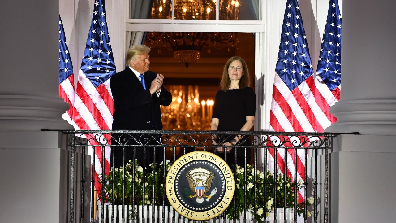 Trump applauds Judge Amy Coney Barrett after she was sworn in as a US Supreme Court Associate Justice.