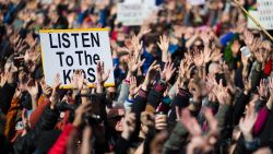 SEATTLE, WA - MARCH 24: People hold their hands up as directed by musician Brandi Carlile at Seattle Center during the March for Our Lives rally on March 24, 2018 in Seattle, Washington. More than 800 March for Our Lives events, organized by survivors of the Parkland, Florida school shooting on February 14 that left 17 dead, are taking place around the world to call for legislative action to address school safety and gun violence. (Photo by Lindsey Wasson/Getty Images)