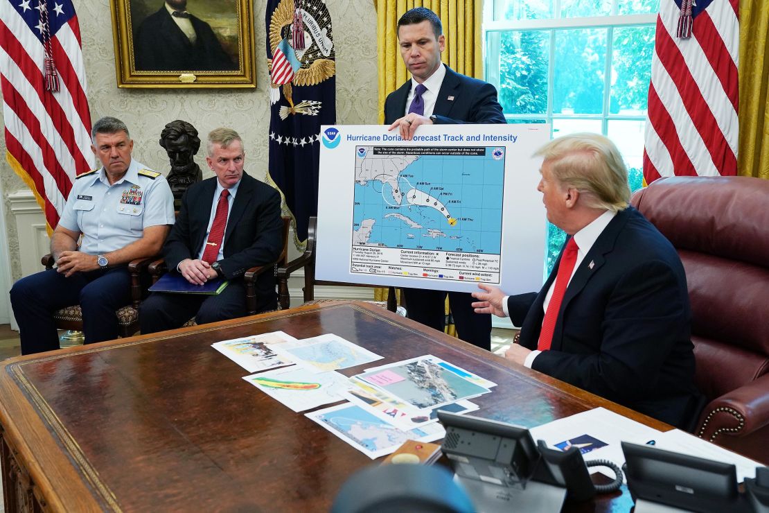 Trump references a map held by acting Homeland Security Secretary Kevin McAleenan while talking to reporters about Hurricane Dorian in the Oval Office at the White House September 4, 2019 in Washington, DC.