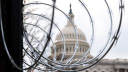 Barbed wire is installed on the top of a security fence surrounding the US Capitol in Washington, DC, January 15, 2021, ahead of next week's presidential inauguration of Joe Biden. (Photo by SAUL LOEB / AFP) (Photo by SAUL LOEB/AFP via Getty Images)
