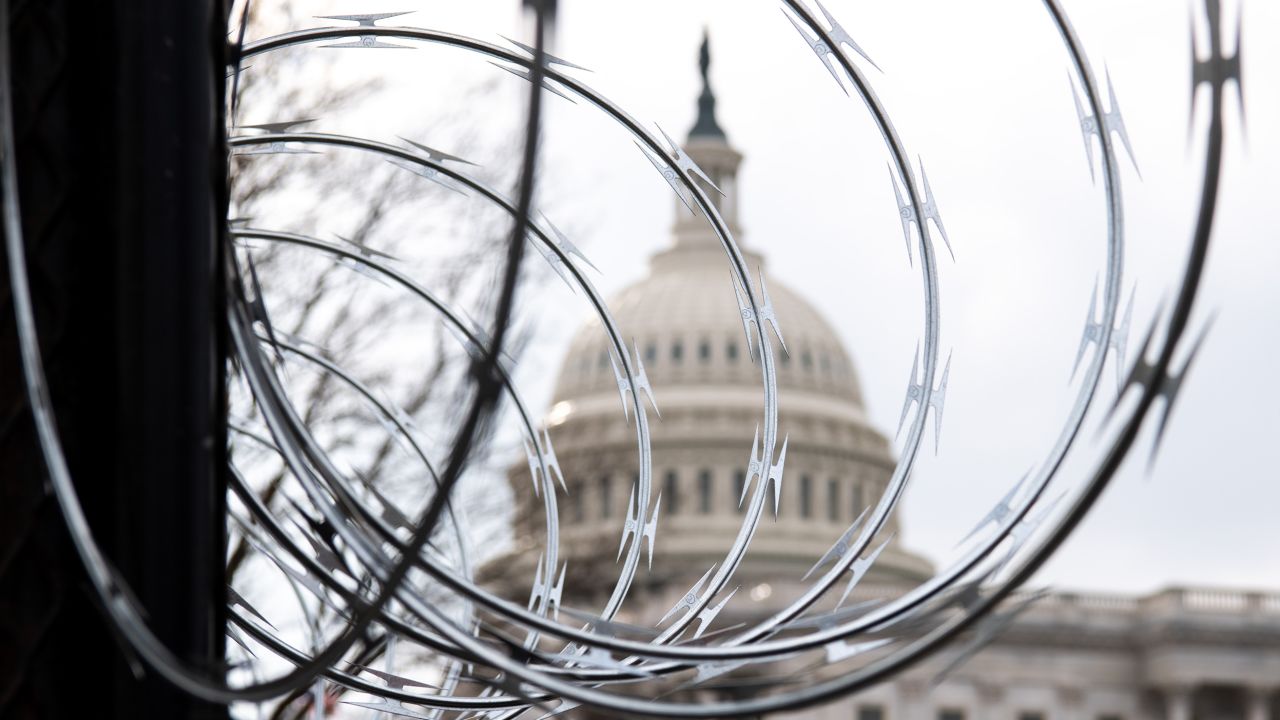 Razor wire is seen on top of a security fence surrounding the US Capitol in Washington, DC, in January. The last of the temporary fencing around the Capitol will be removed starting Friday. 