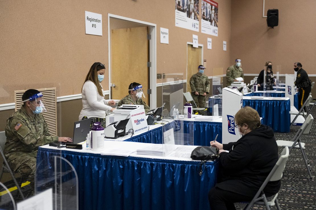 National Guard members assist with check-ins for vaccines in New Jersey.