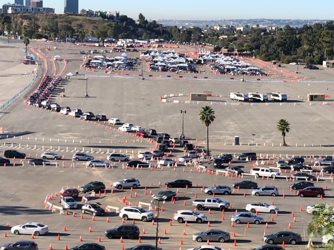 Numerous vehicles are lined up at a vaccination site near Dodger Stadium in Los Angeles on Saturday morning.