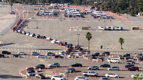 Numerous vehicles are lined up at a vaccination site near Dodger Stadium in Los Angeles on Saturday morning.
