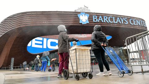 People await access to a mobile food pantry at Barclays Center in Brooklyn, New York, on April 24.