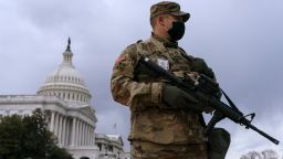 With the U.S. Capitol in the background, a member of the Virginia National Guard stands at the ready inside the secured Capitol complex, on Saturday, Jan. 16, 2021, in Washington, as security is increased ahead of the inauguration of President-elect Joe Biden and Vice President-elect Kamala Harris. (AP Photo/Jacquelyn Martin)