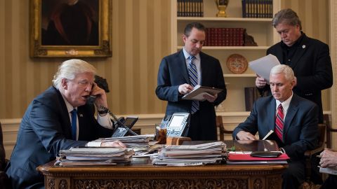 Trump speaks on the phone with Vladimir Putin in the Oval Office on January 28, 2017.