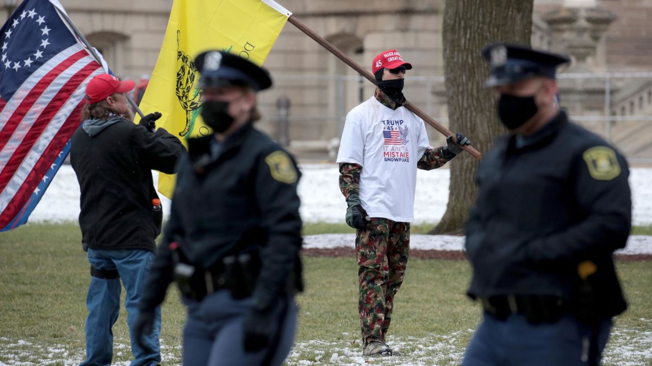 Demonstrators protest outside of the Michigan state capital building on January 17, 2021, in Lansing, Michigan.