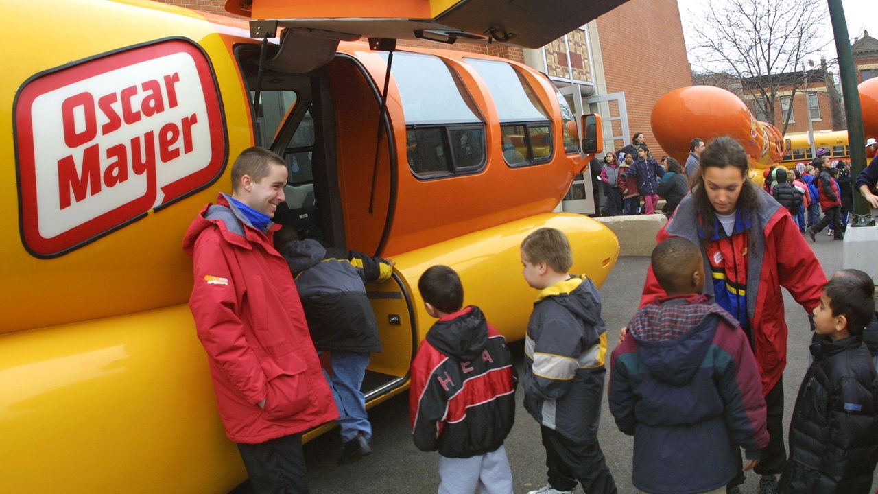 Students line up to tour an Oscar Mayer Wienermobile on January 23, 2002, at Oscar Mayer Elementary School in Chicago.