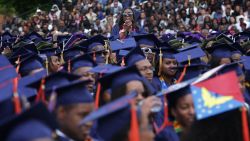 WASHINGTON, DC - MAY 07:  Ciearra Jefferson (C) of Detroit, Michigan, a member of the class of 2016, reacts as U.S. President Barack Obama mentions about her in his address for the 2016 commencement ceremony at Howard University May 7, 2016 in Washington, DC. President Obama is the sixth sitting U.S. president to deliver the commencement speech at Howard University.  (Photo by Alex Wong/Getty Images)