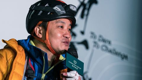 Lai Chi-wai talking to the press after climbing 250 meters (820 feet) up a skyscraper in Hong Kong on January 16.