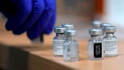 A health worker prepares a Pfizer-BioNTech COVID-19 vaccine during a vaccination campaign of members of the Emergency Medical Services of Madrid (SUMMA) in Madrid on January 12, 2021. 