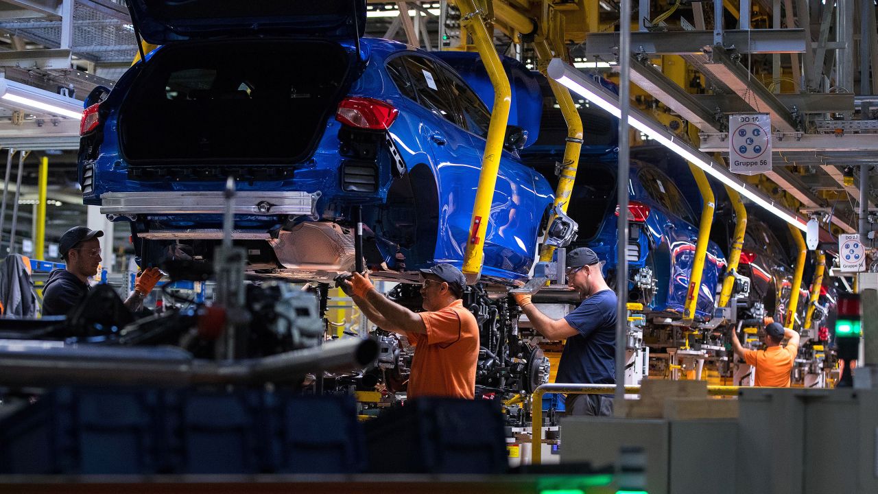 Workers fit Focus chassis inside the Ford factory in Saarlouis, Germany, in 2019.