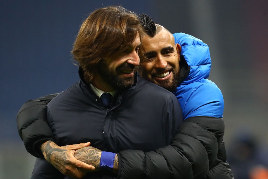 Arturo Vidal hugs former Juventus teammate Andreo Pirlo at full time.