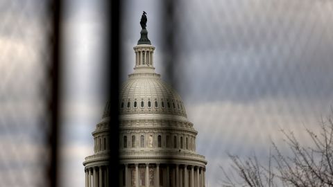  The U.S. Capitol dome is seen beyond a security fence on January 17, 2021. 