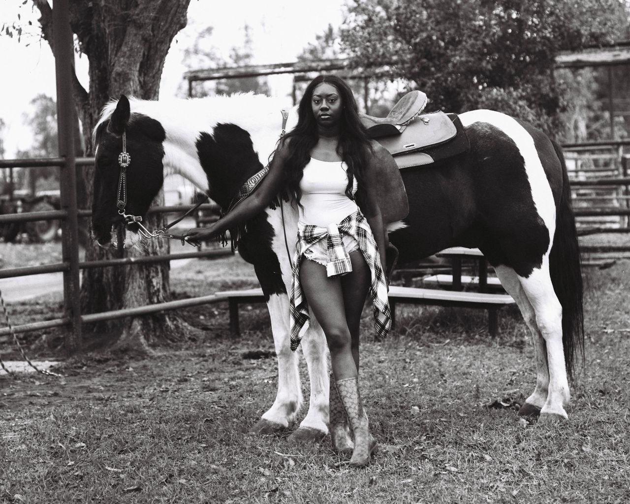 Cowboy culture has long been associated with White men in rural America. In "Ridin' Sucka Free," Kennedi Carter takes portraits of  Black men, women and children who ride and care for horses.