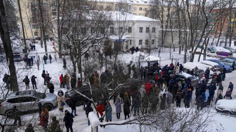 Members of the media and supporters of Navalny gather near the police station in Khimki on Monday.