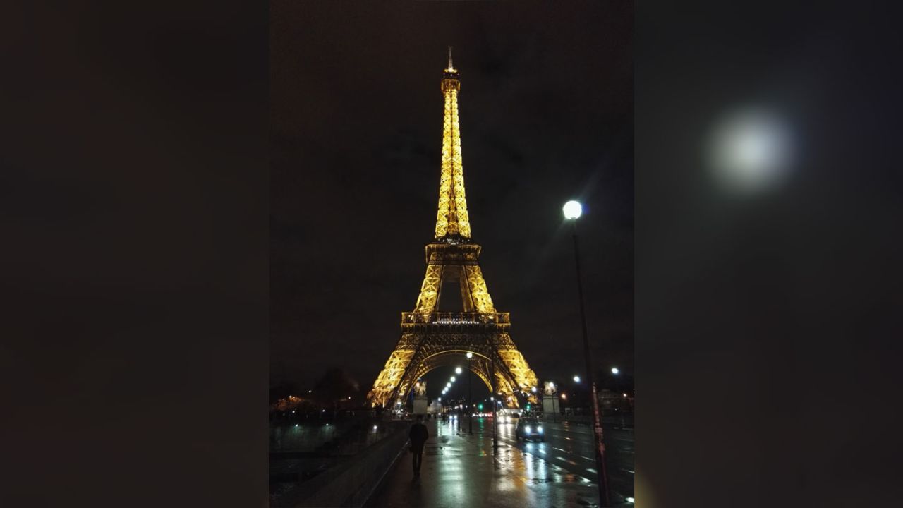 While killing time alone in Paris, McAfee snapped this shot of the Eiffel Tower lit up at night. 