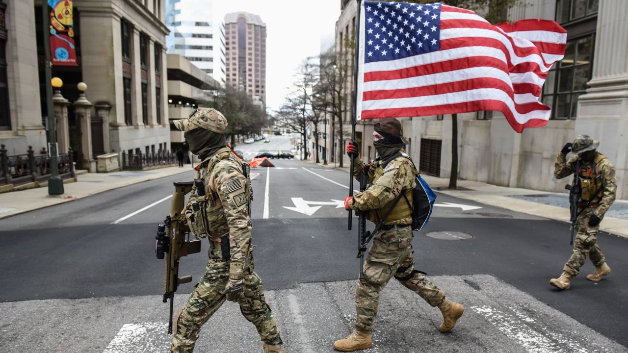 Members of a pro-gun group carry their weapons near the state Capitol on January 18, 2021 in Richmond, Virginia.