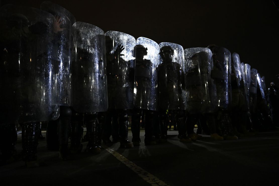 Riot police prepare to move demonstrators away from the US Capitol in Washington, DC, on January 6, 2021.