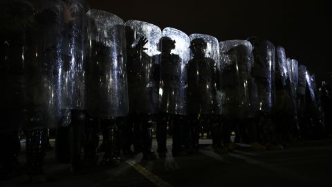 Riot police prepare to move demonstrators away from the US Capitol in Washington, DC, on January 6, 2021.