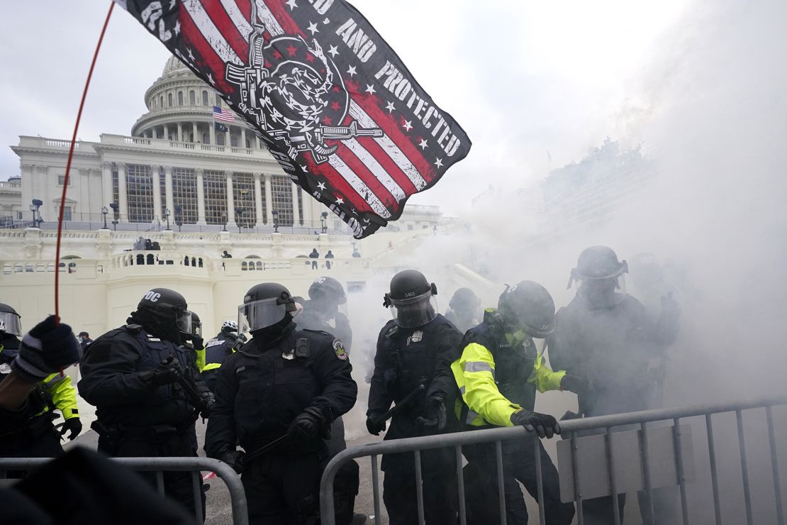 Police hold off Trump supporters who tried to break through a police barrier, Wednesday, January 6, 2021, at the Capitol in Washington. 