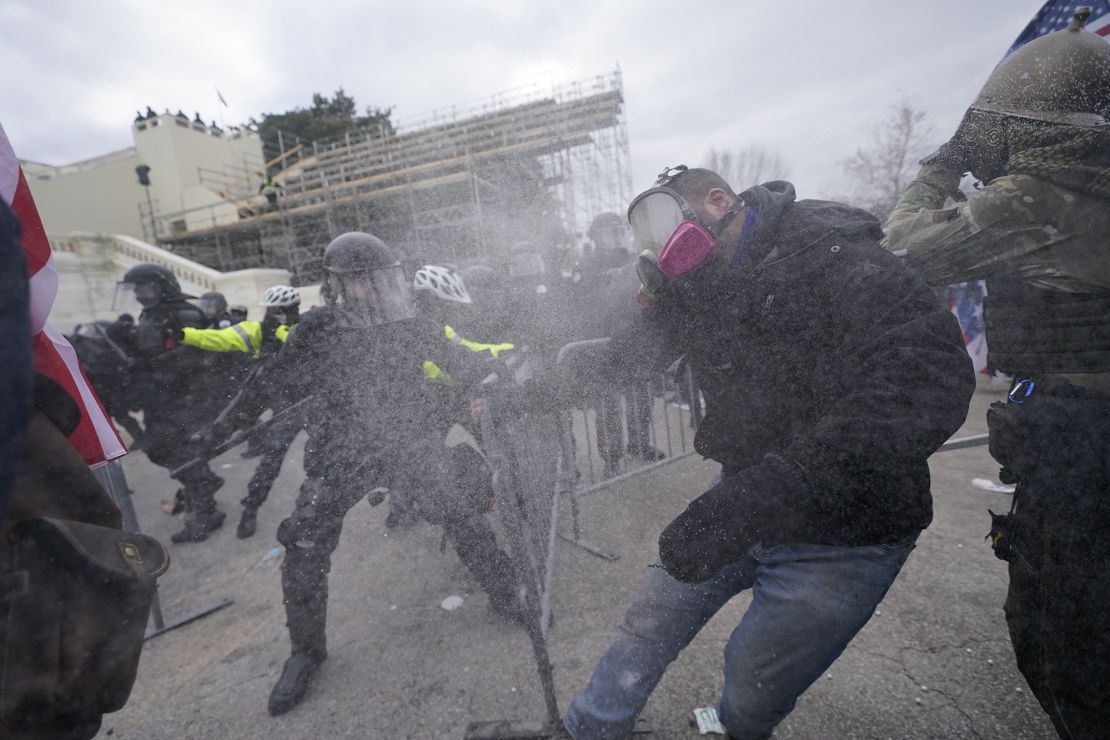 Trump supporters try to break through a police barrier, Wednesday, January 6, 2021, at the Capitol in Washington. 