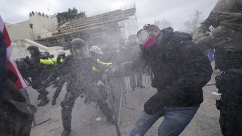 Trump supporters try to break through a police barrier, Wednesday, January 6, 2021, at the Capitol in Washington.