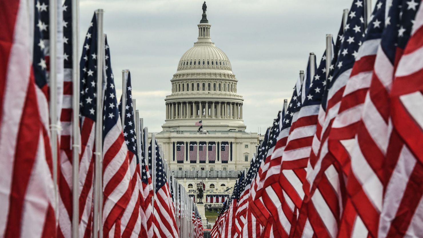 The Capitol building is surrounded by American flags a day before the inauguration of President-elect Joe Biden. 