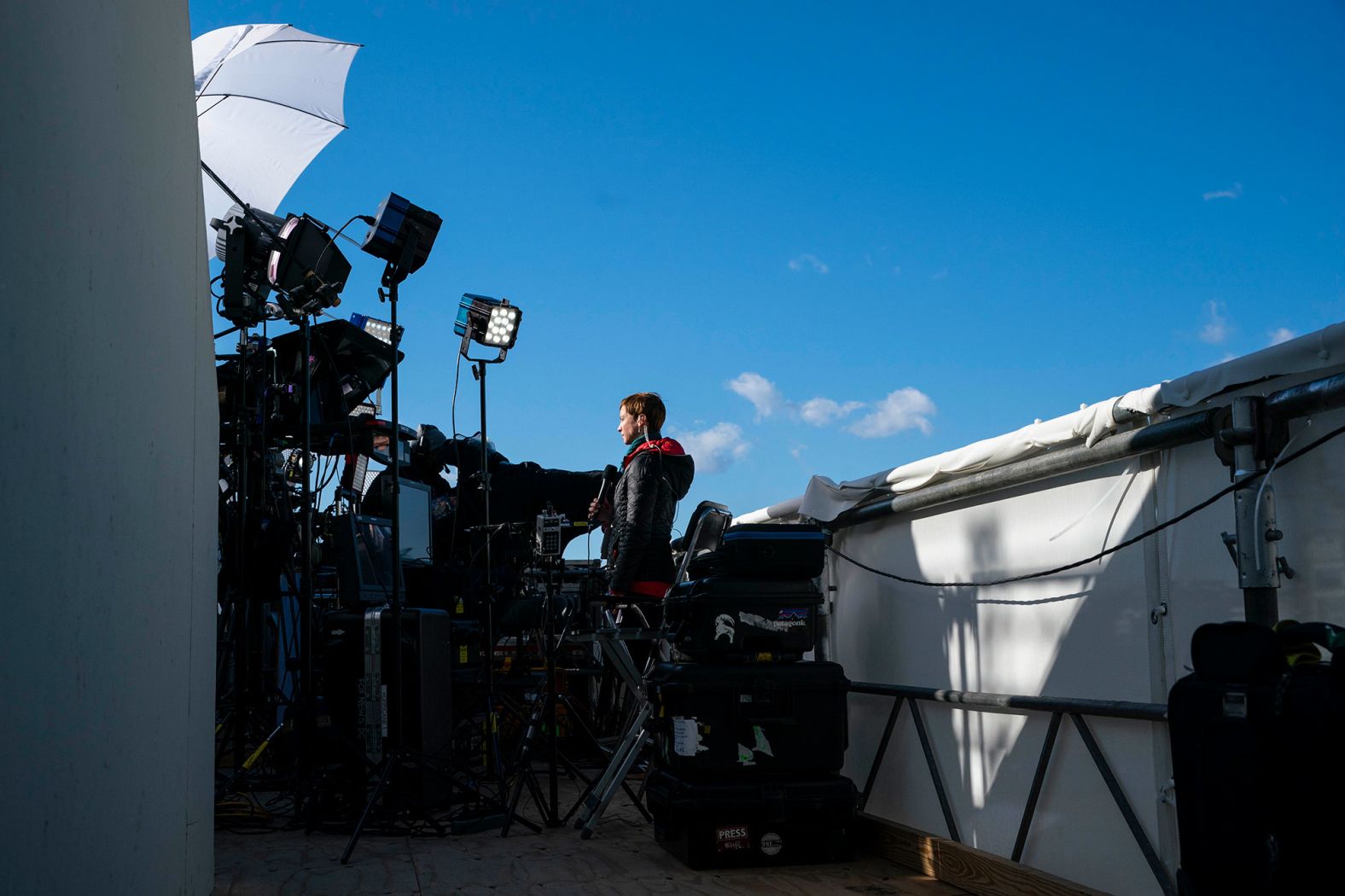 A television reporter works at the Capitol on the day before the inauguration.