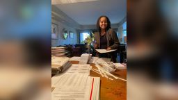 Human-rights lawyer Tara Murray founded Mamas for Momala, a group that mobilized voters in battleground states to support the Biden-Harris presidential ticket. In this photo, Murray prepares packages of postcards her group sent to Georgia voters.
