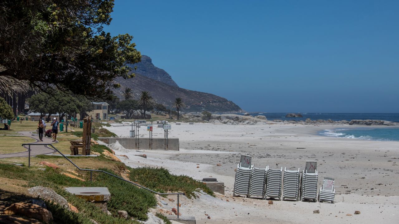 Stacked sunloungers on an empty Camps Bay beach, closed due to Covid-19 regulations, in Cape Town, South Africa, on Monday, Jan. 11, 2021. The pandemic and restrictions imposed to contain it have devastated Africa's most industrialized economy, and the extension of curbs that came into effect at the height of the holiday season bode ill for efforts to engineer a rebound. Photographer: Dwayne Senior/Bloomberg via Getty Images