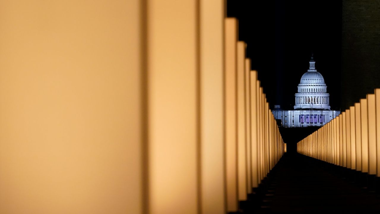 Lights surround the Lincoln Memorial Reflecting Pool, placed as a memorial to COVID-19 victims Tuesday, Jan. 19, 2021, in Washington, after President-elect Joe Biden spoke, with the U.S. Capitol in the background. (AP Photo/Alex Brandon)
