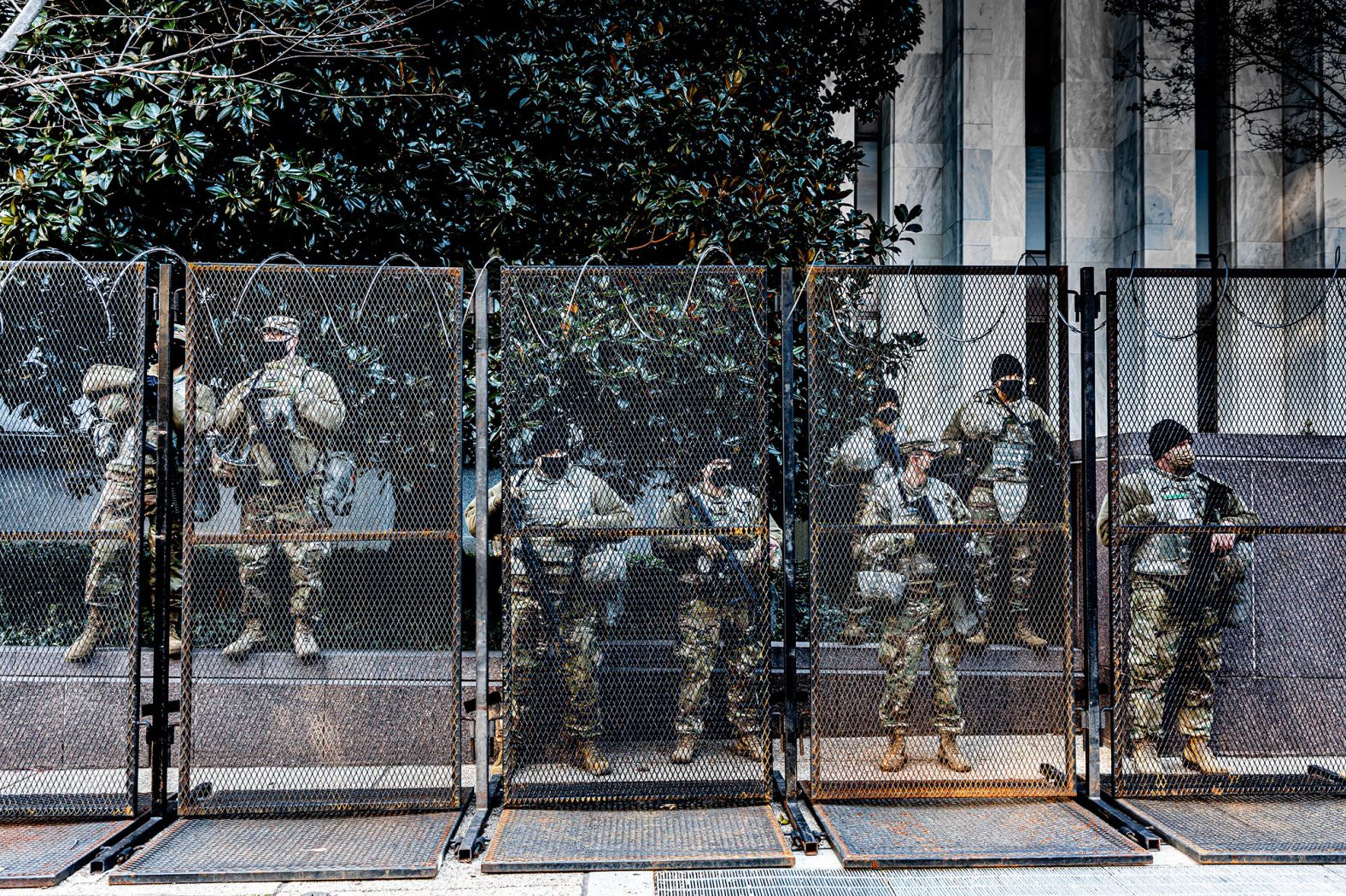 Members of the National Guard are positioned within a security perimeter that includes the Capitol, the White House and the National Mall.