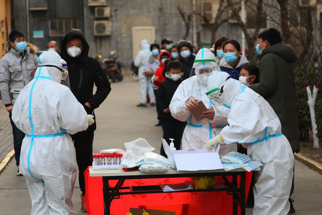 Citizens line up for the third round of testing in Shijiazhuang on January 18.