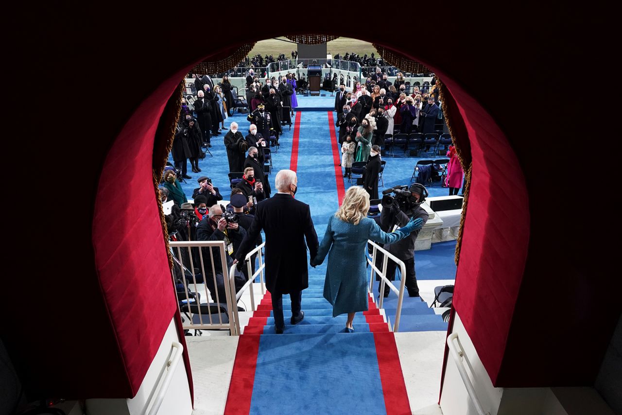 The Bidens walk out for the inauguration.