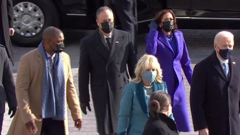 Eugene Goodman, the Capitol Police officer who led rioters away from the Senate during the January 6 insurrection, escorts Kamala Harris to the inauguration ceremony.