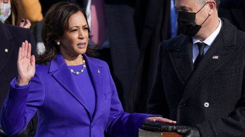 Kamala Harris is sworn in as Vice President as her spouse Doug Emhoff holds Bible. 