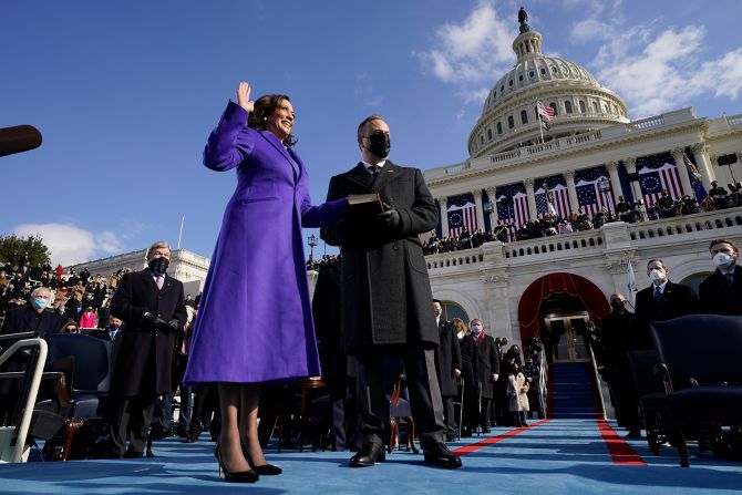 Harris is sworn in as vice president as her husband holds the Bible. Harris was sworn in by Supreme Court Justice Sonia Sotomayor. She wore the color purple <a href="index.php?page=&url=https%3A%2F%2Fwww.cnn.com%2Fpolitics%2Flive-news%2Fbiden-harris-inauguration-day-2021%2Fh_ce6f777c3f47c0f7d262b4ae26c0d62f" target="_blank">as a nod to Shirley Chisholm,</a> the first African-American woman to run for president.