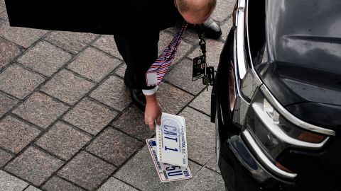 Officials transfer motorcade license plates ahead of the inauguration.