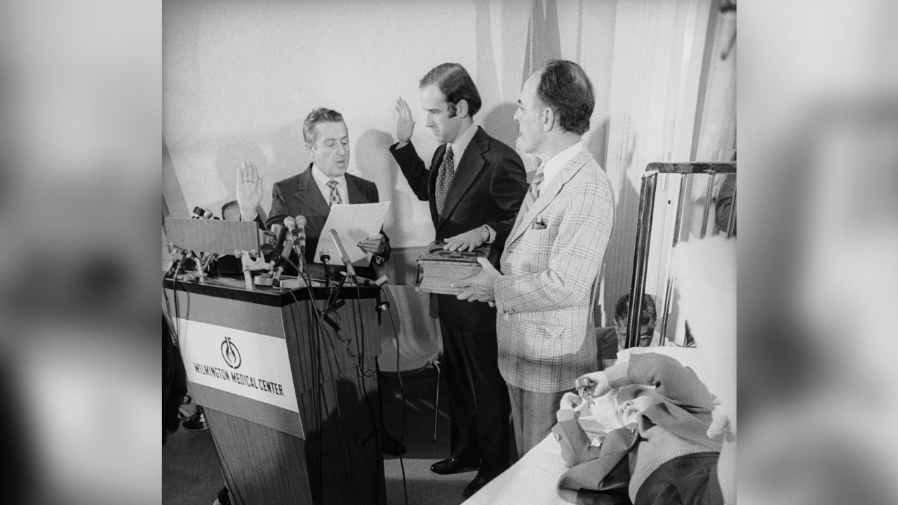Senator Joseph Biden takes the oath of office from the U.S. Senate's secretary, Frank Valeo with his father-in-law Robert Hunter and son Joseph Beau Biden at his side, in Beau's hospital room. Last month Beau and his brother Robert Hunter were injured in an auto accident that killed their mother Nealia and younger sister Amy. Senator Biden took the oath here with the permission of the Senate so that he could remain in Wilmington until both children were well. Beau is in traction while Hunter has recovered.
Date created:
January 06, 1973